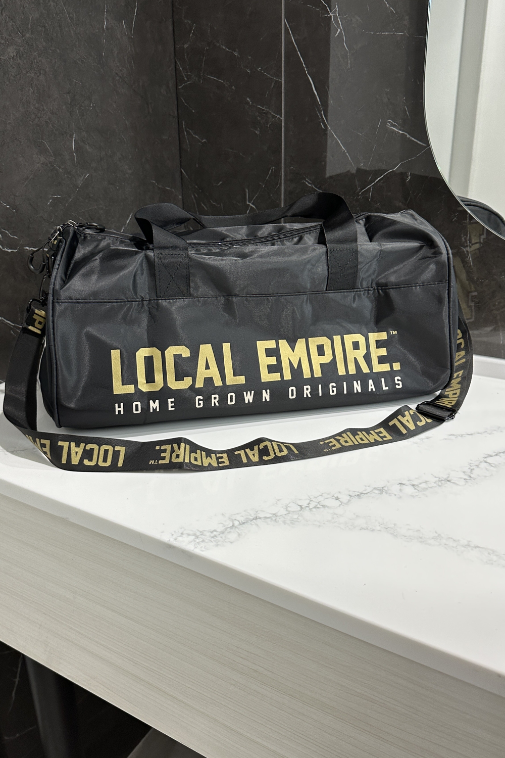 Black and gold gym top bag